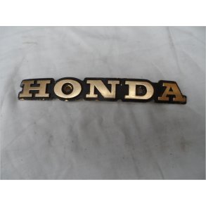 Honda emblem brugt guld,med huller til skruer. L=200mm 